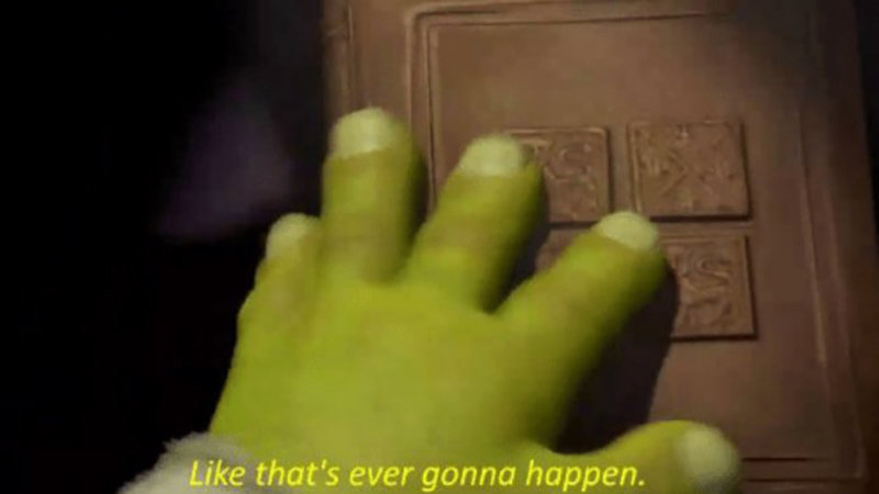 A big green hand belonging to Shrek closing a book, with the subtitles saying "Like that's ever gonna happen".